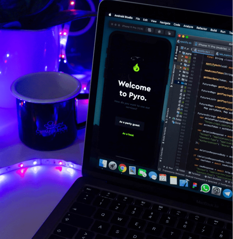 Image of the half laptop screen with react native app development coding.